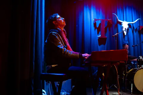 Keyboard player at the side of the stage at the 2025 Jason Molina MusiCares benefit.