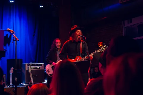 Singer and backing musicians performing on stage at the 2025 Jason Molina MusiCares benefit.