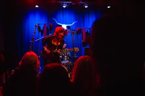 Percussionist performing behind hand drums at the 2025 Jason Molina MusiCares benefit.