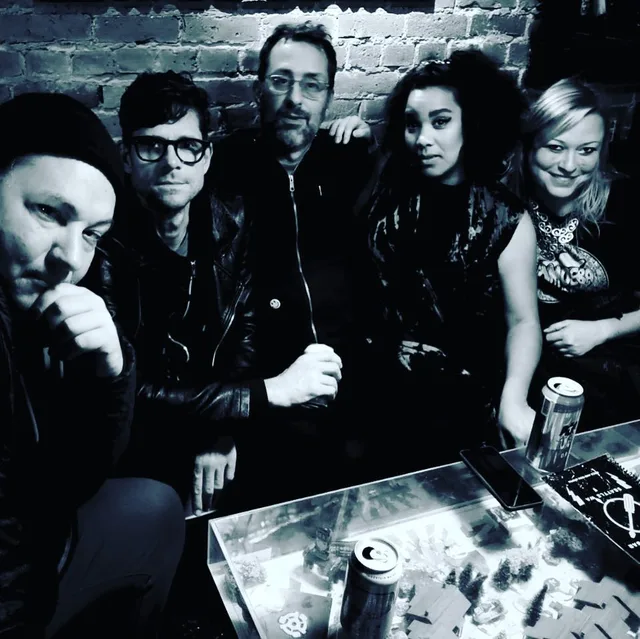 Group Photo On Couch In Bar Before Show.