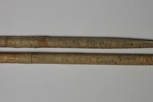 Archival photo of broken drumsticks.